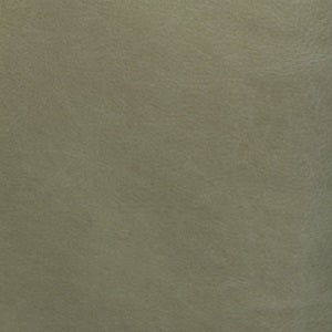 A close-up of green textured leather, known as Fermo leather.