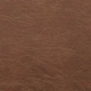 A close-up of rust-colored Mustang leather, showcasing its textured surface and rich, warm tone.