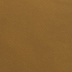 A swatch of Romagna leather in a rich caramel color, showcasing a smooth and even texture.